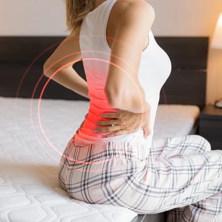 Person holding their back in pain.