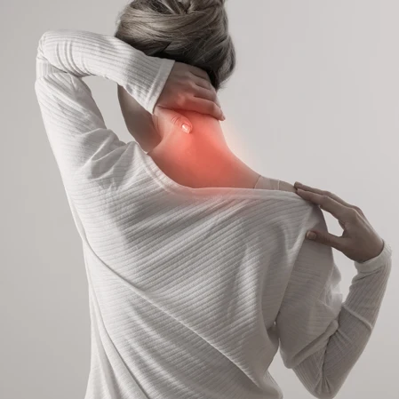 Person holding their head in pain.